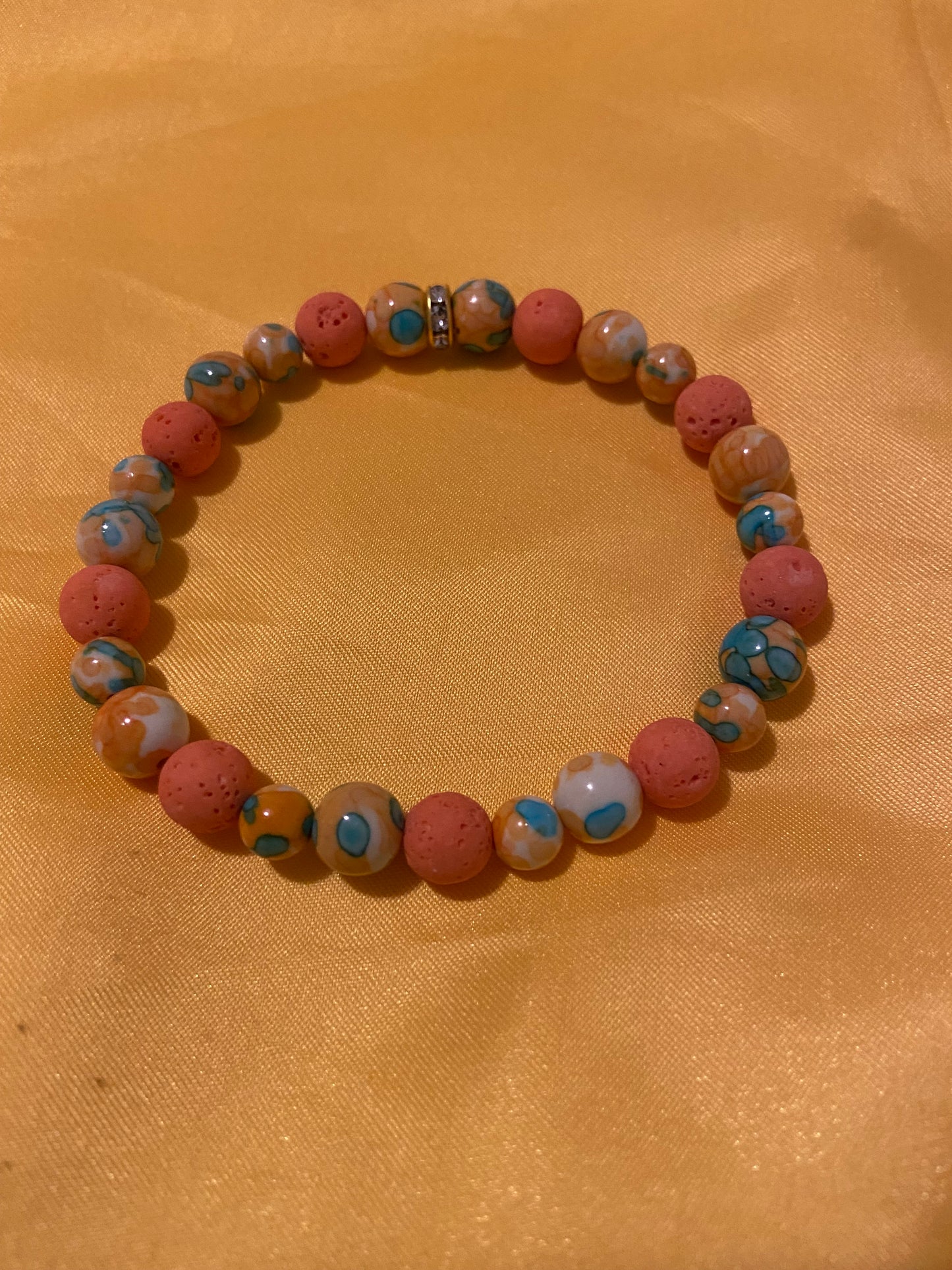 NATURAL ORANGE BLUE DOT STONE