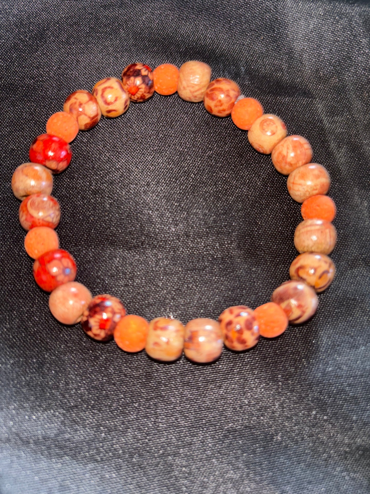 WOODEN TRIBAL BEAD WITH ORANGE LAVA BEAD