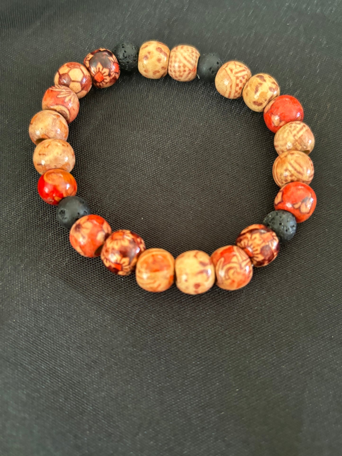 WOODEN TRIBAL BEAD WITH BLACK LAVA BEAD