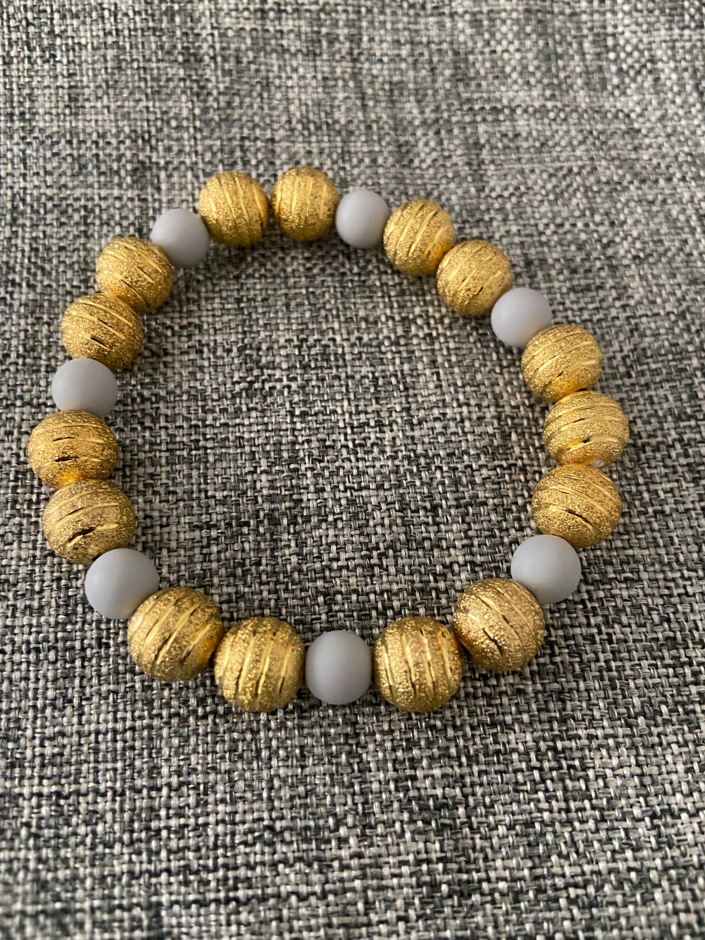 GOLD WITH CLAY BEAD