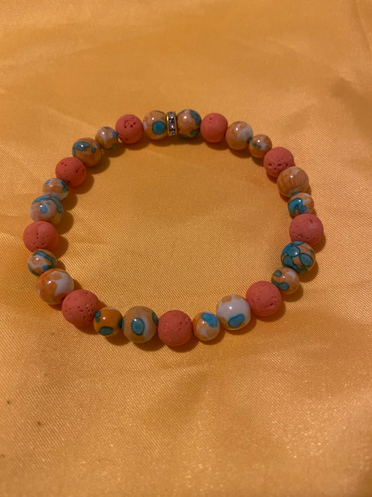 NATURAL ORANGE BLUE DOT STONE