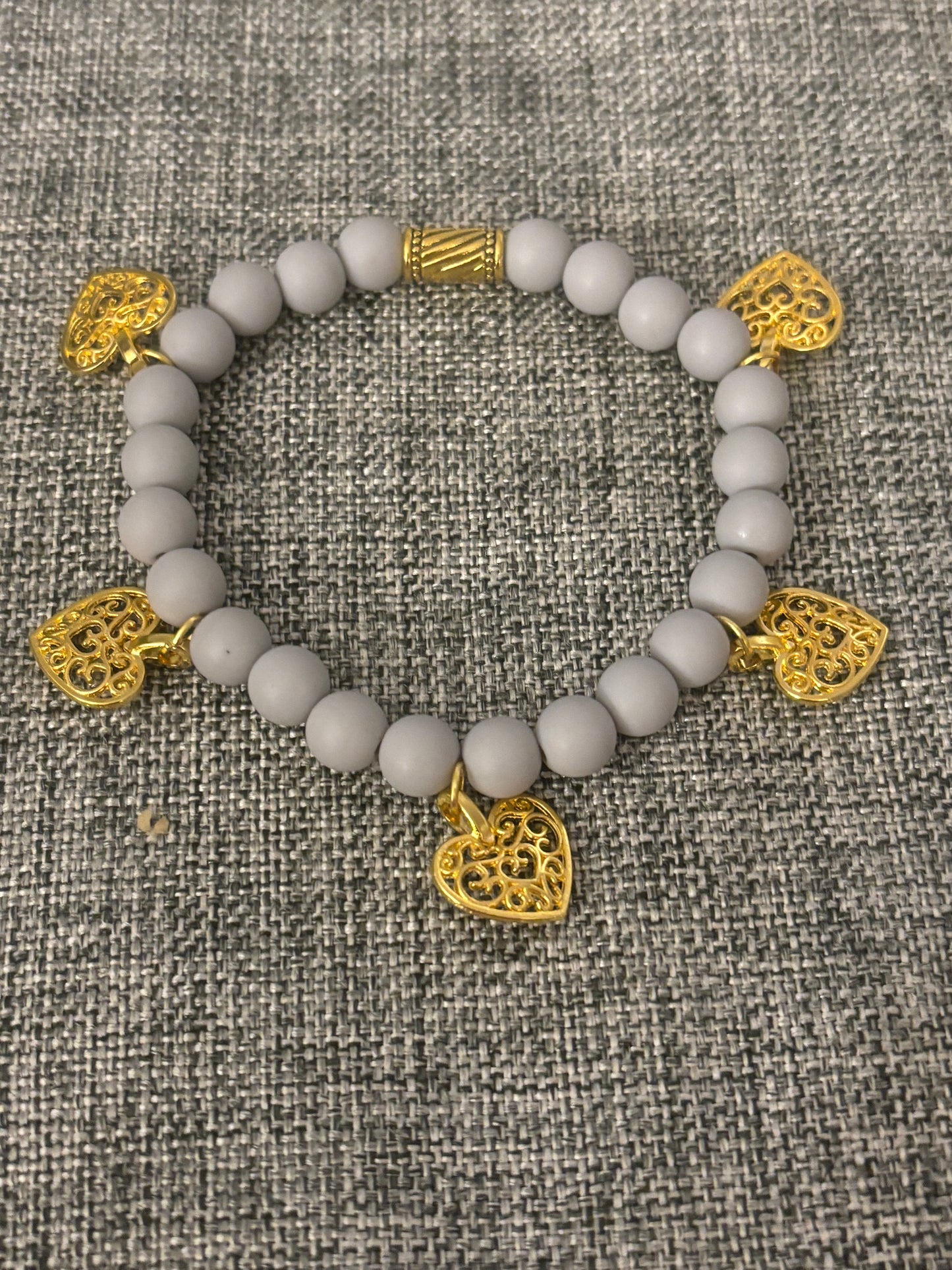 GREY CLAY BEAD WITH GOLD PLATED HEARTS