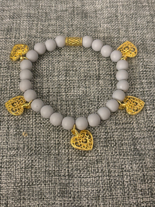 GREY CLAY BEAD WITH GOLD PLATED HEARTS