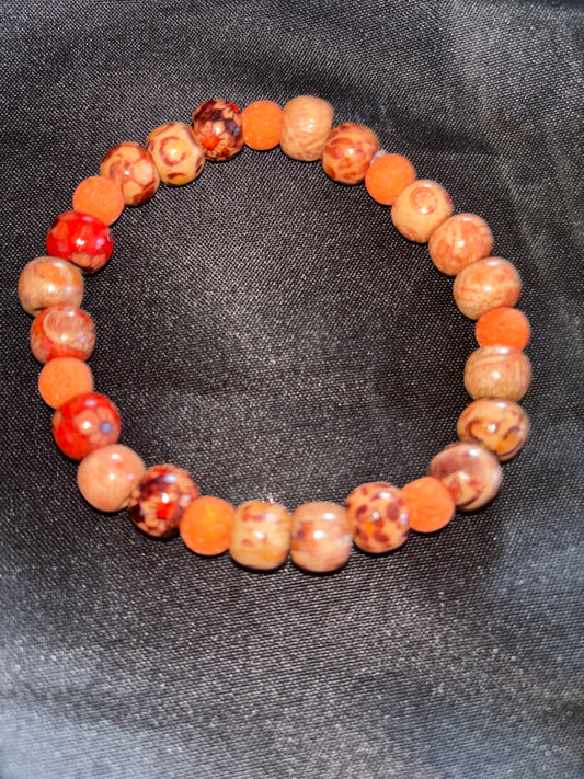 WOODEN TRIBAL BEAD WITH ORANGE LAVA BEAD