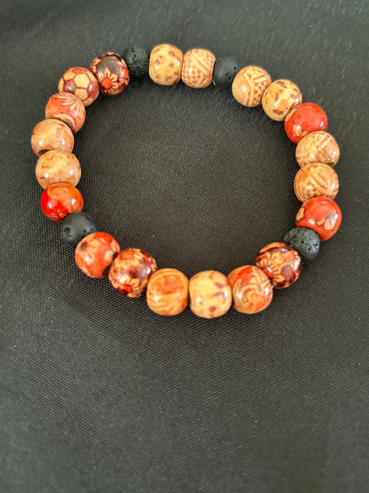 WOODEN TRIBAL BEAD WITH BLACK LAVA BEAD
